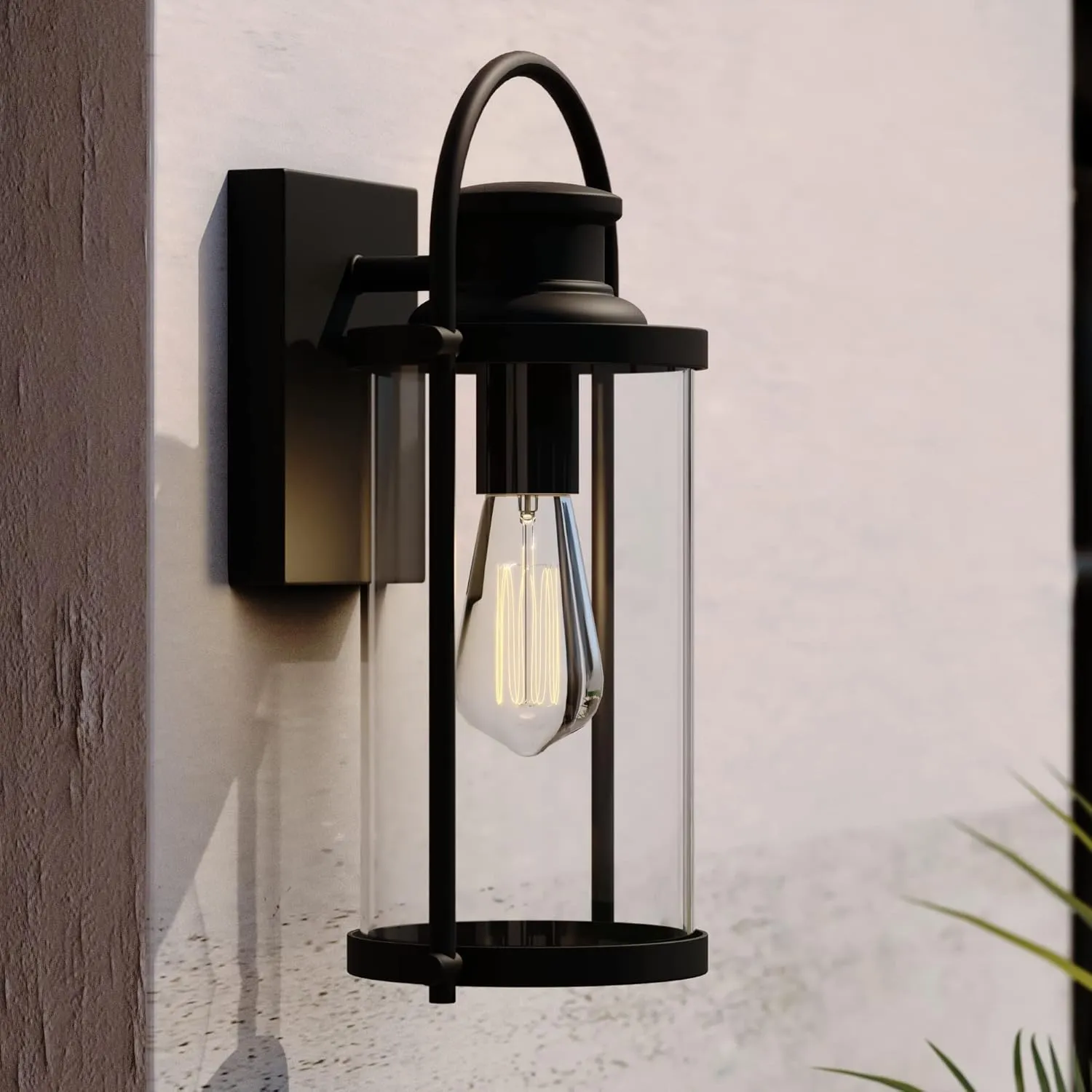 VAXCEL Winfield 1 Light Dusk to Dawn Matte Black Outdoor Wall Lantern Clear Cylinder Glass